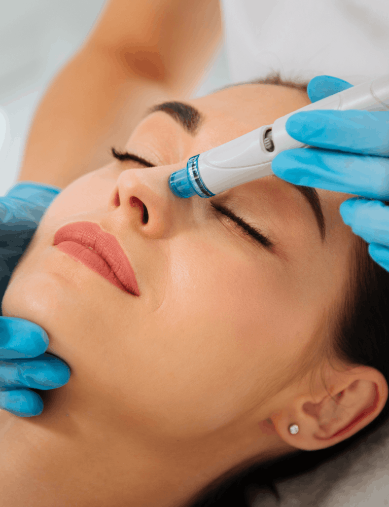 Dermatologist performing a HydraFacial treatment on a patient at a skin clinic in Chennai.